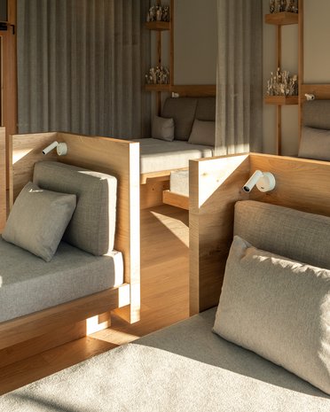 Current news and stories from Olang Modern relaxation room with comfortable loungers and wood decor in natural light