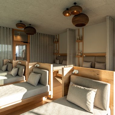Alpenreych & Hubertus Park Modern relaxation room with comfortable loungers and wood decor in natural light