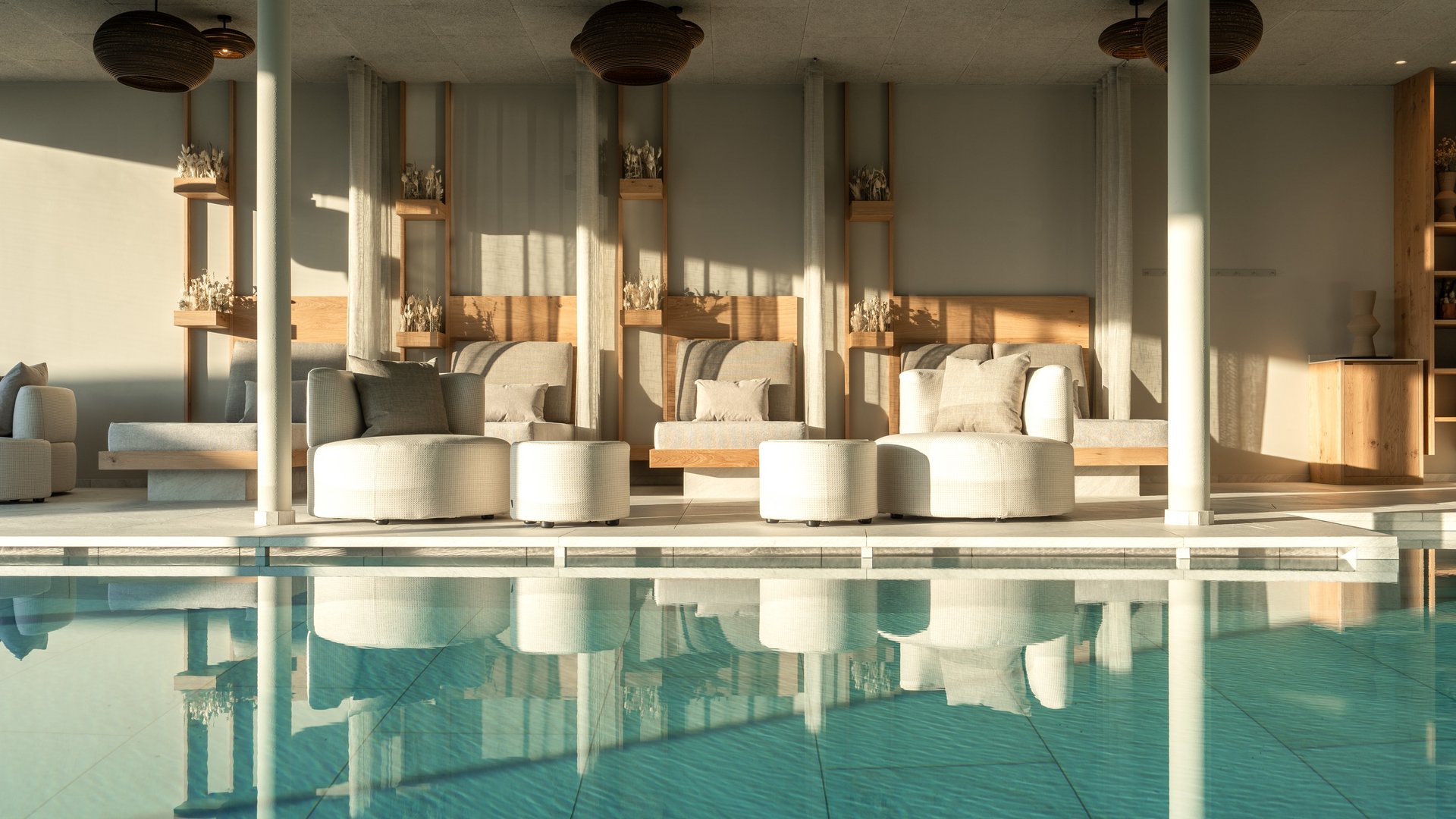 Our Sky Pool in South Tyrol, a rare beauty Bright lounge area with pool and comfortable modern seating