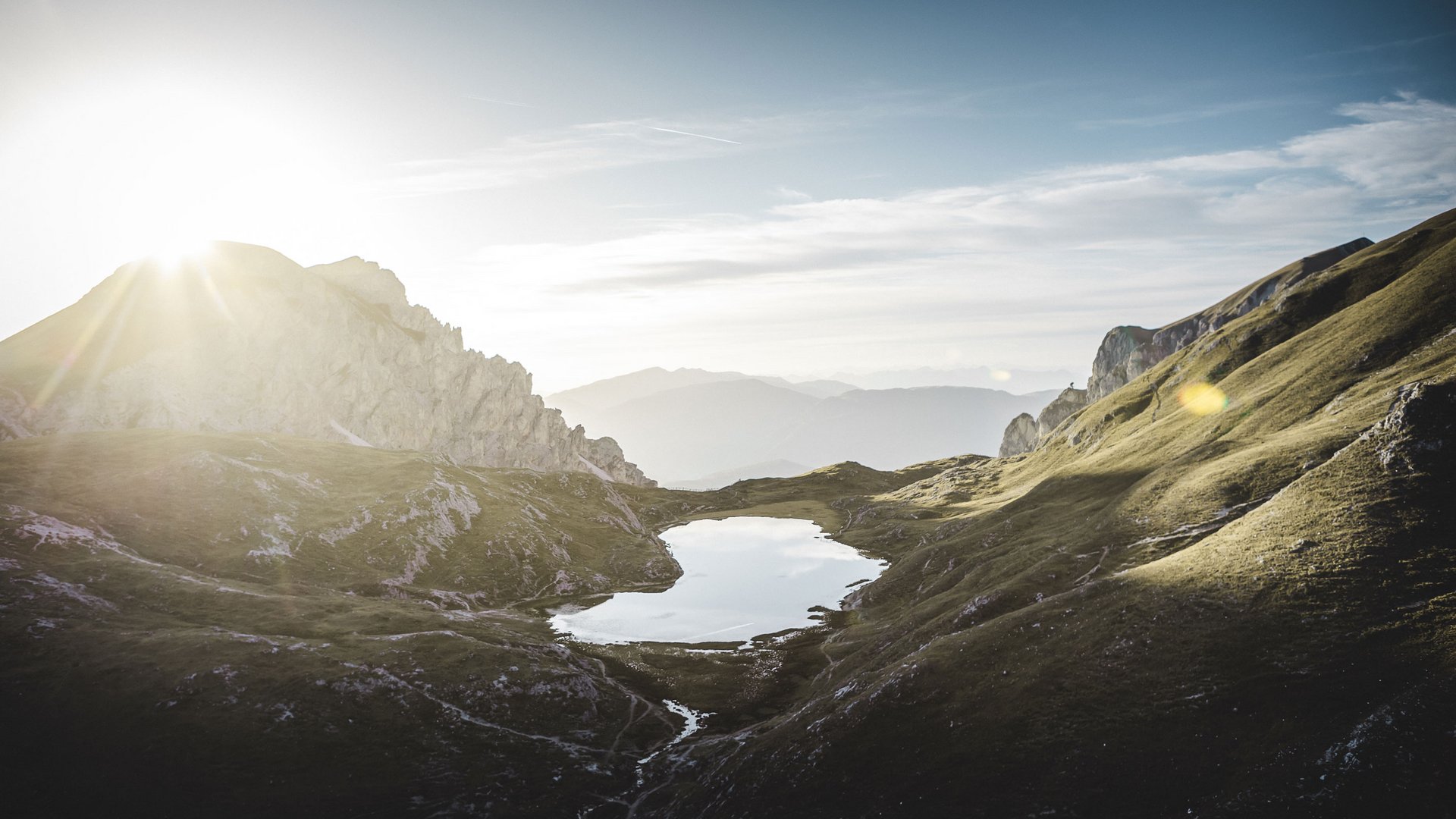 Active holidays in South Tyrol: a great experience Sunrise over a mountain lake in an alpine valley