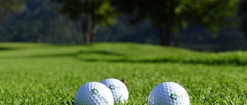 Current news and stories from Olang Three golf balls on green grass with trees in the background