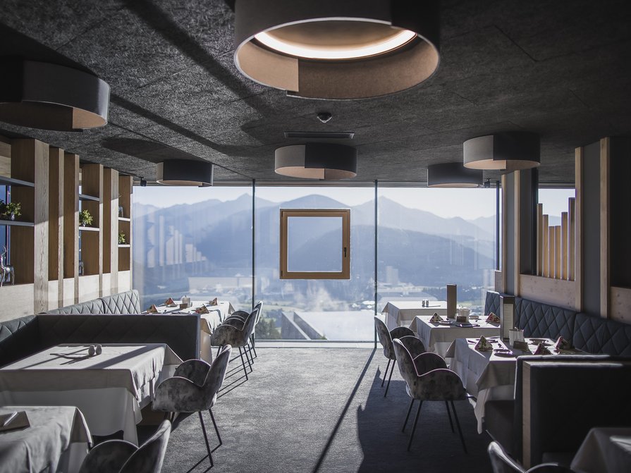 Our 5-star hotel in Italy between heaven and earth Modern restaurant with mountain view through large windows