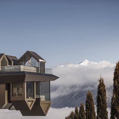 Certified quality for you Modern viewing platform above clouds with snowy mountains and cypress trees