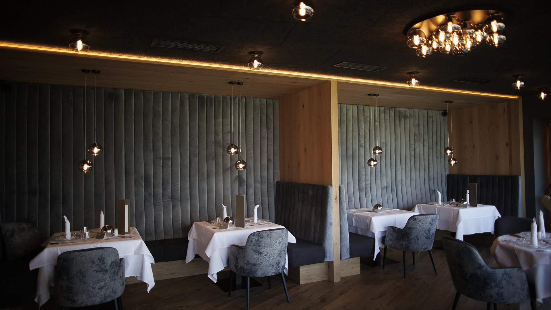 A place to enjoy Modern restaurant lounge with dim lighting and elegant tables