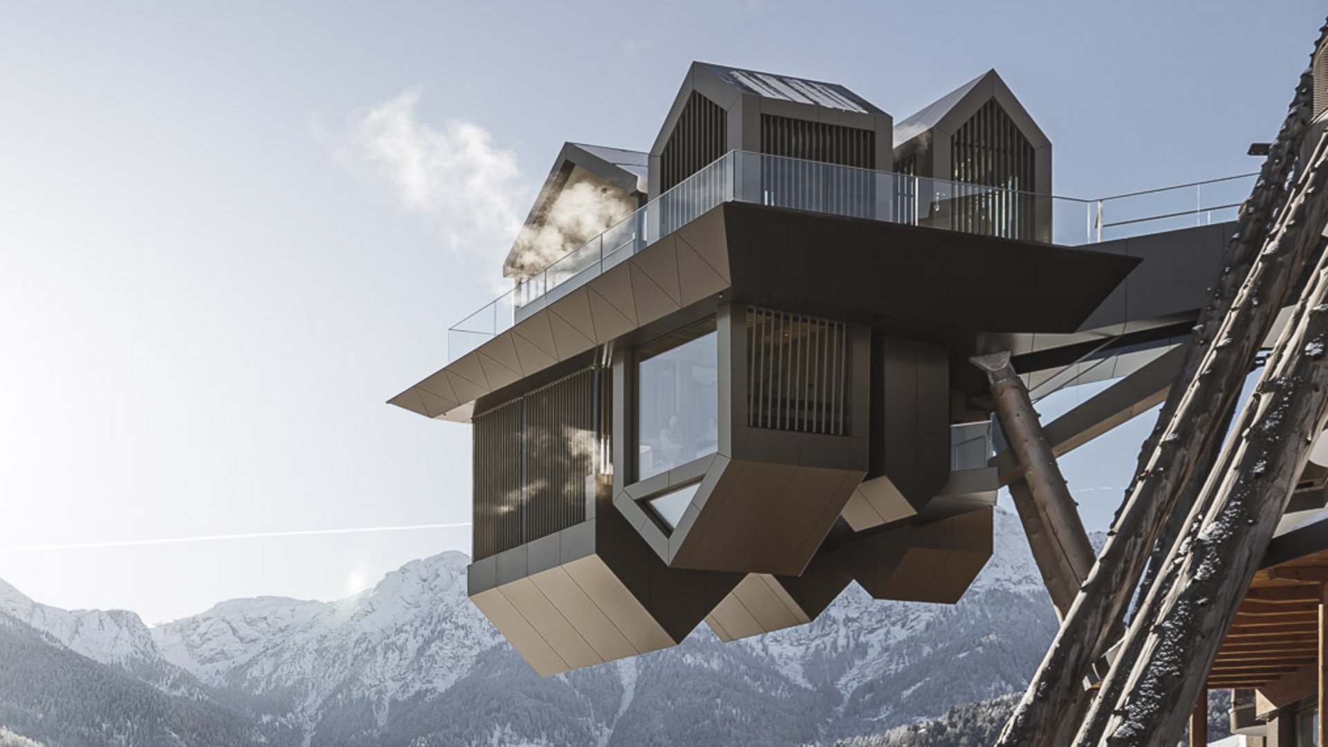 Our Sky Pool in South Tyrol, a rare beauty Modern balcony overlooking snow-covered mountains with sunlight